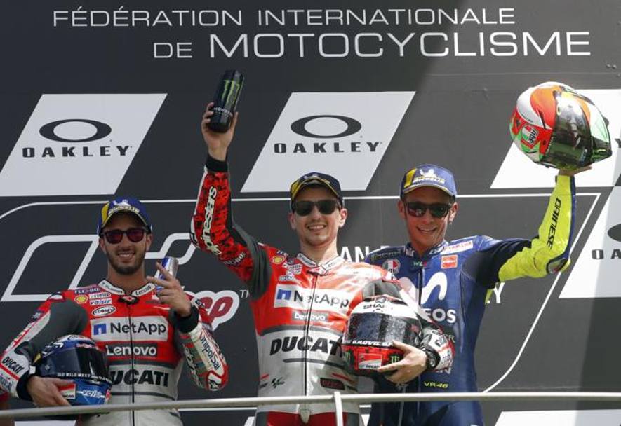 I tre del podio, da sinistra Dovizioso, Lorenzo e Rossi. Ap 